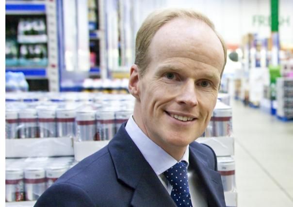 Tesco Booker merger Charles Wilson chief executive